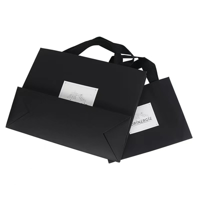 OEMの黒の白い服装の紙袋の衣類のマーブル紙のギフト袋